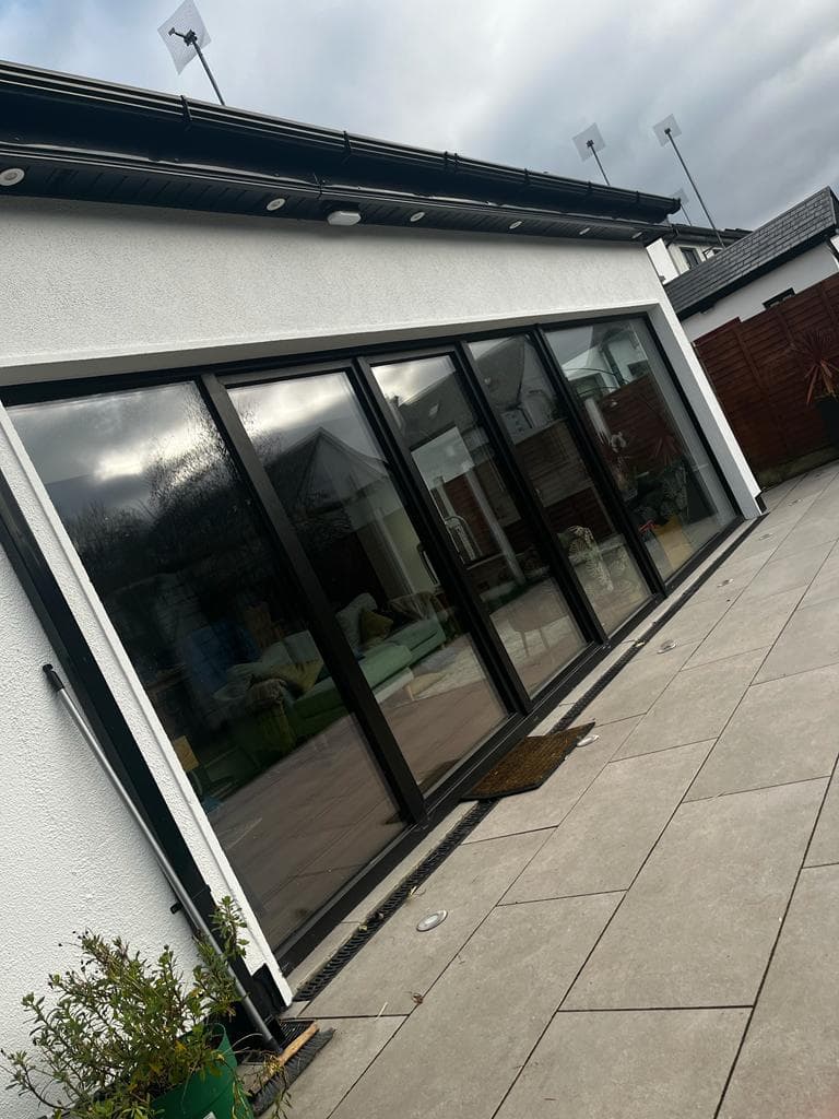 Aluminium sliding doors with a threshold drainage channel fitted by KRB Construction and Windows in Galway
